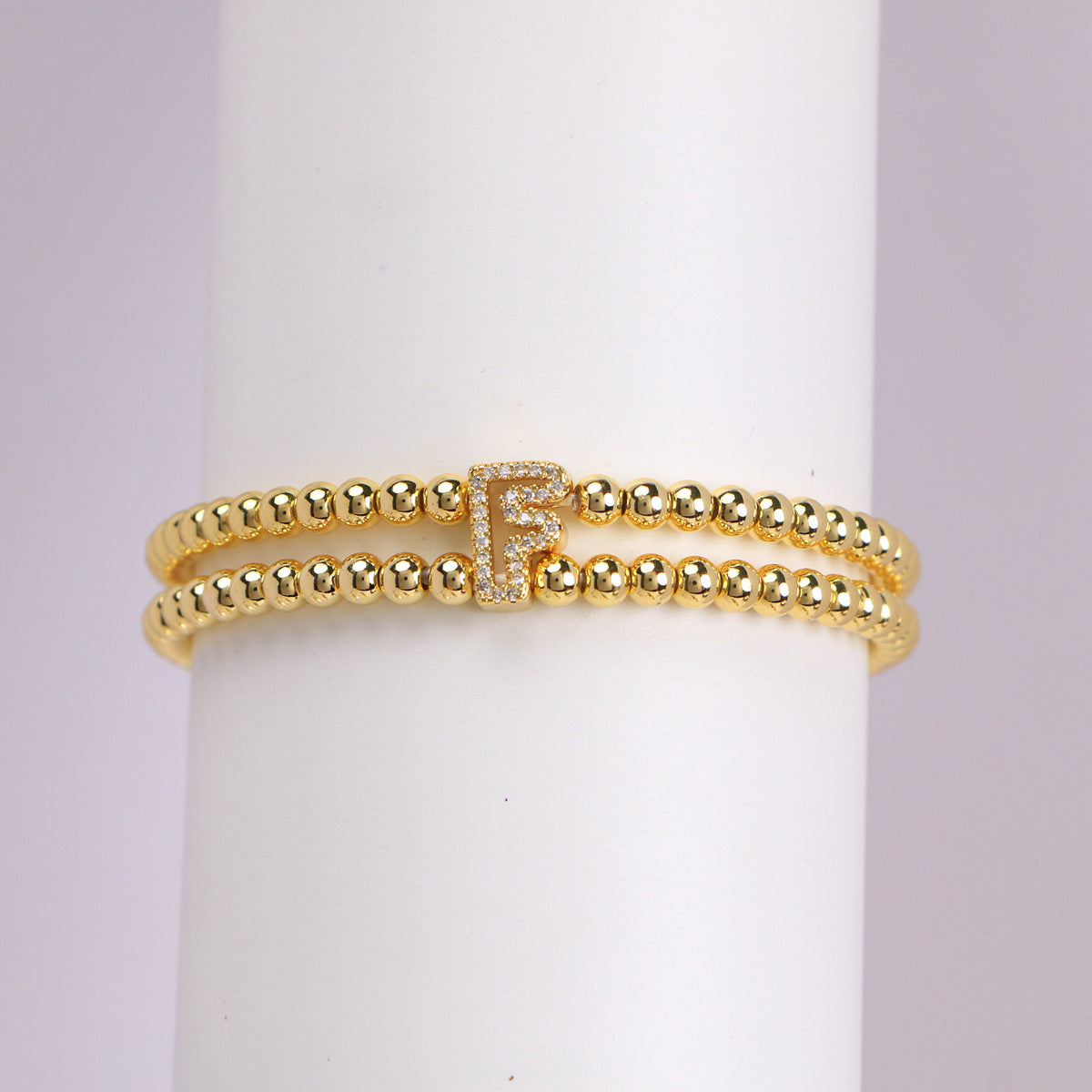 A cute and y 18k copper-plated bubble 26-letter elastic string beaded bracelet