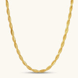 18K gold-plated twisted double herringbone snake chain necklace with lobster clasp and extender on white background.