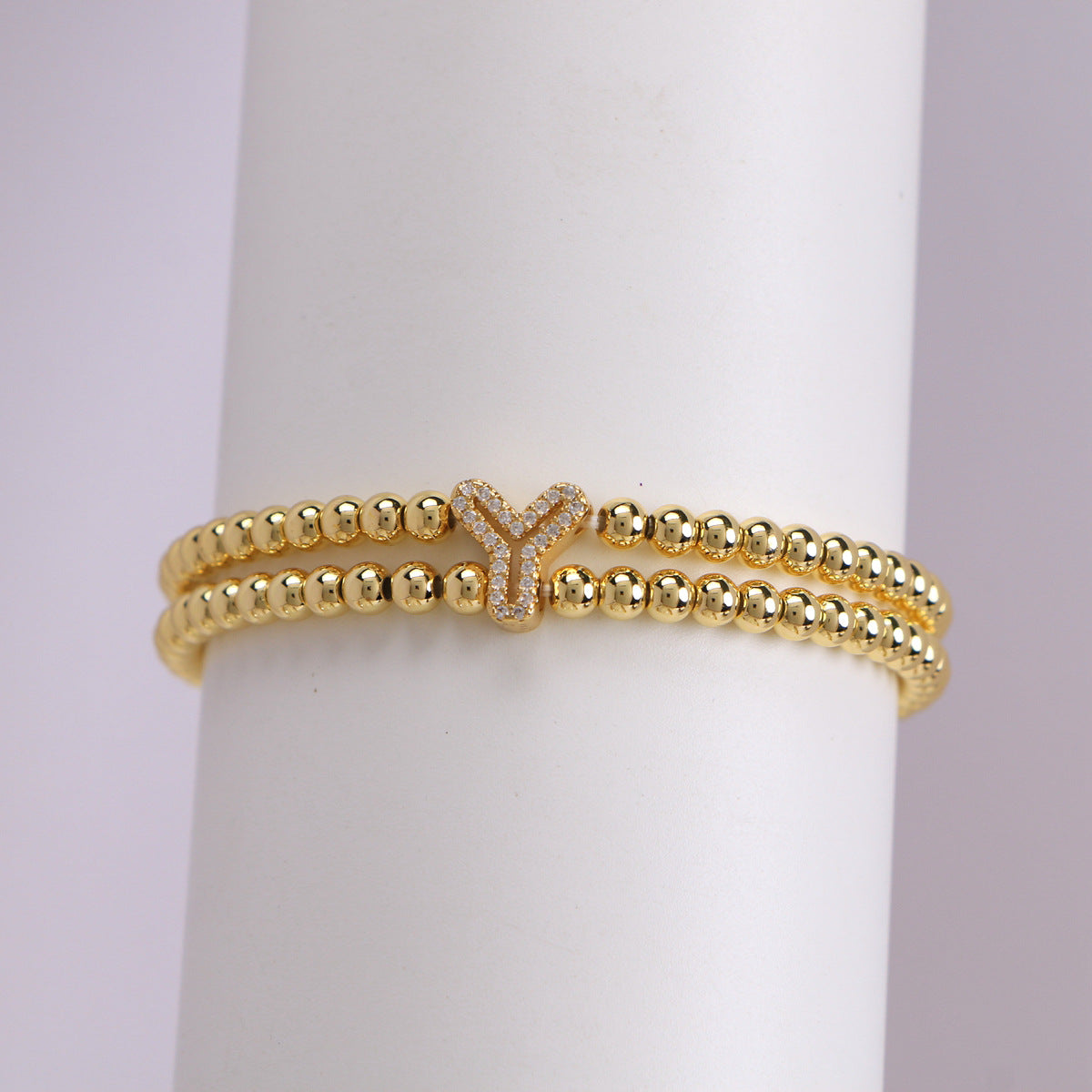 A cute and y 18k copper-plated bubble 26-letter elastic string beaded bracelet