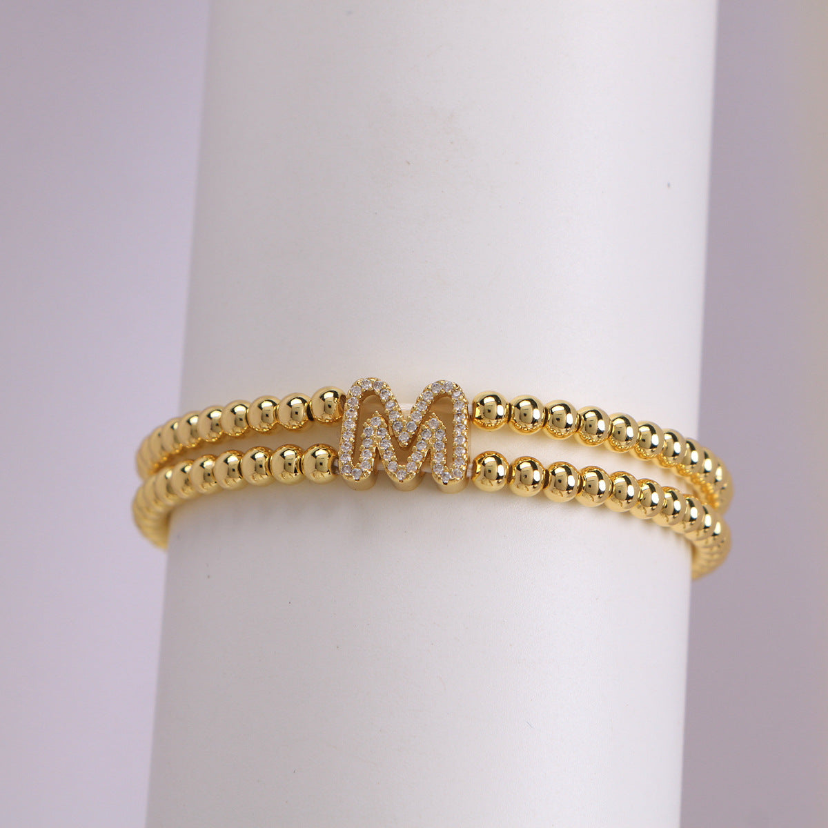 A cute and y 18k copper-plated bubble 26-letter elastic string beaded bracelet