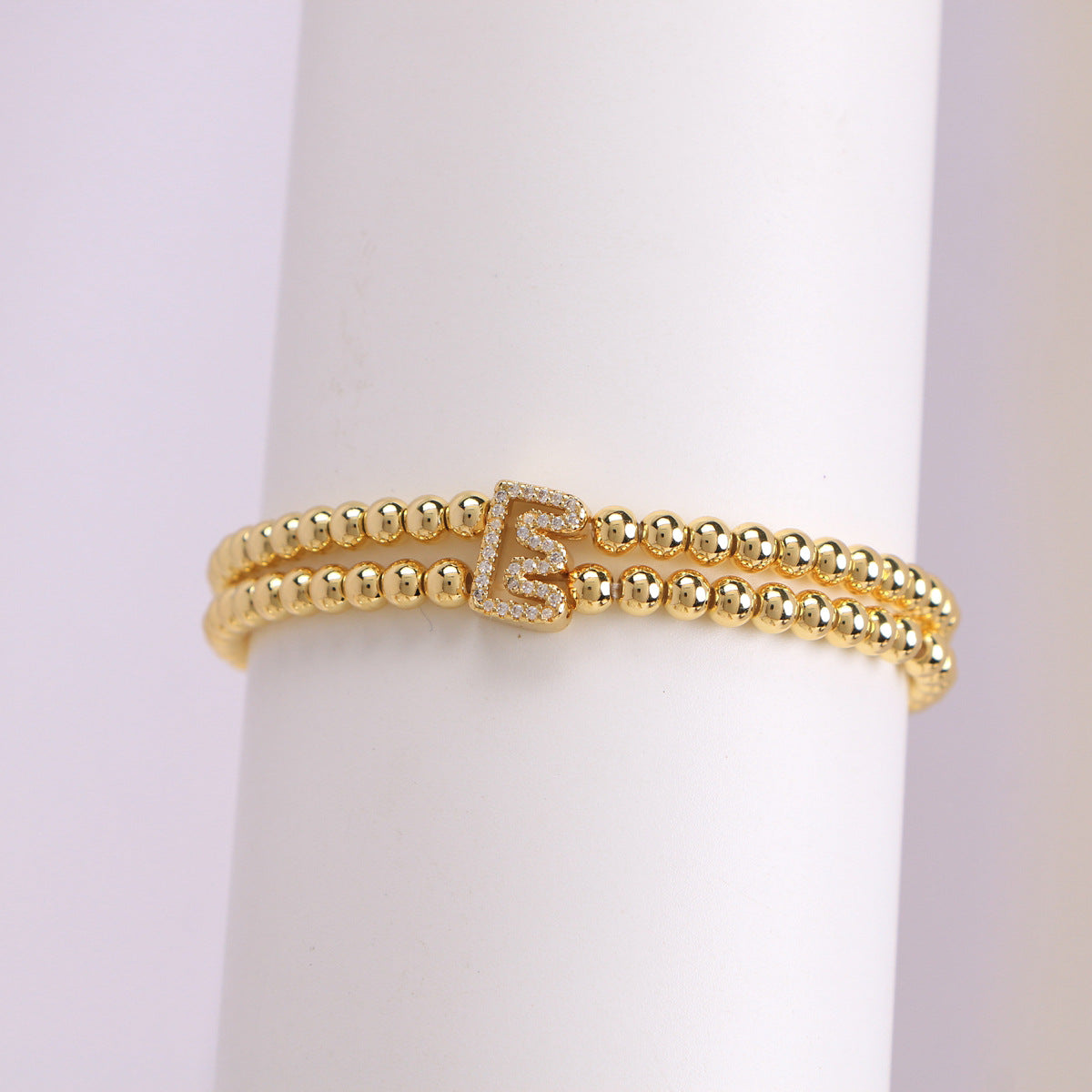 A cute and y 18k copper-plated bubble 26-letter elastic string beaded bracelet