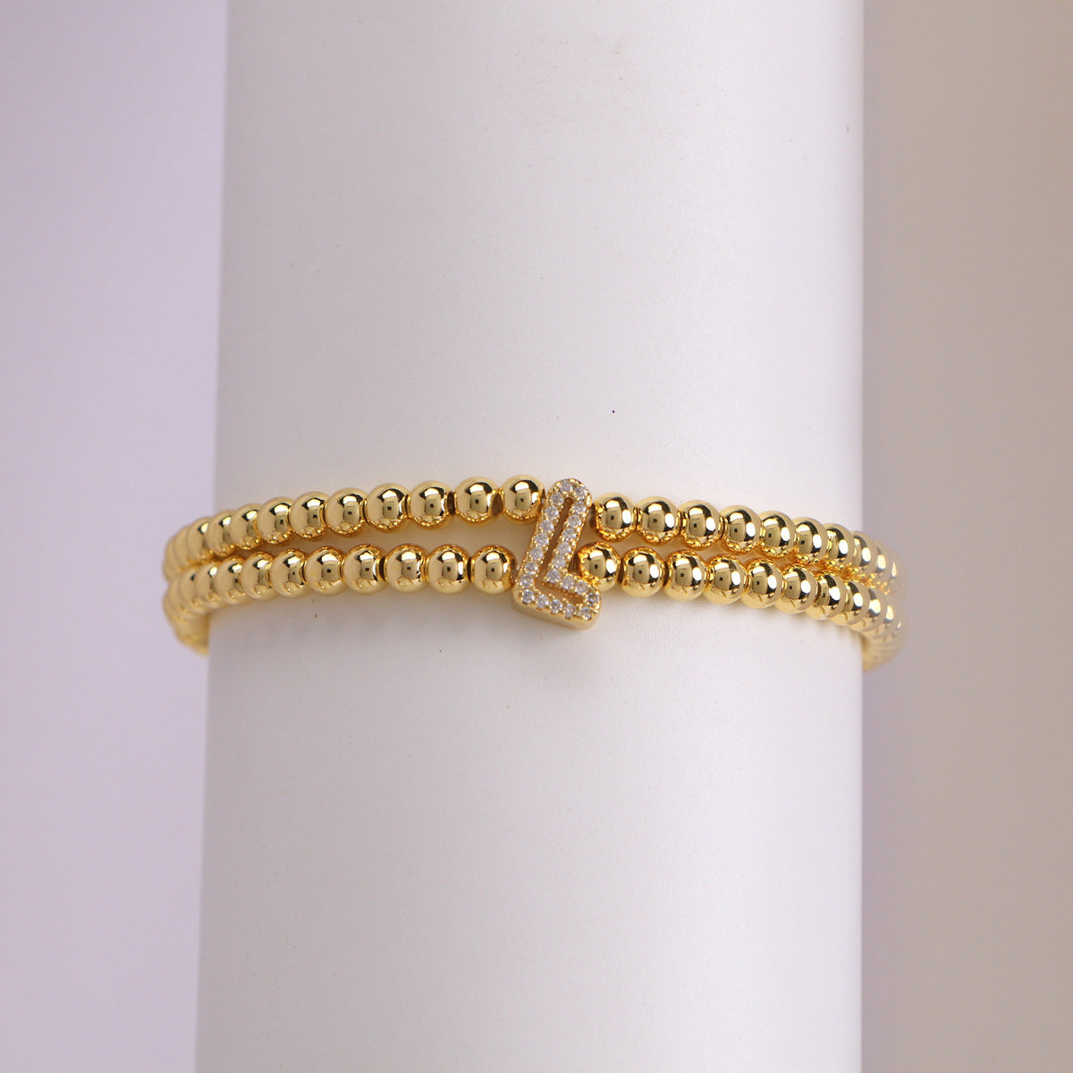 A cute and y 18k copper-plated bubble 26-letter elastic string beaded bracelet