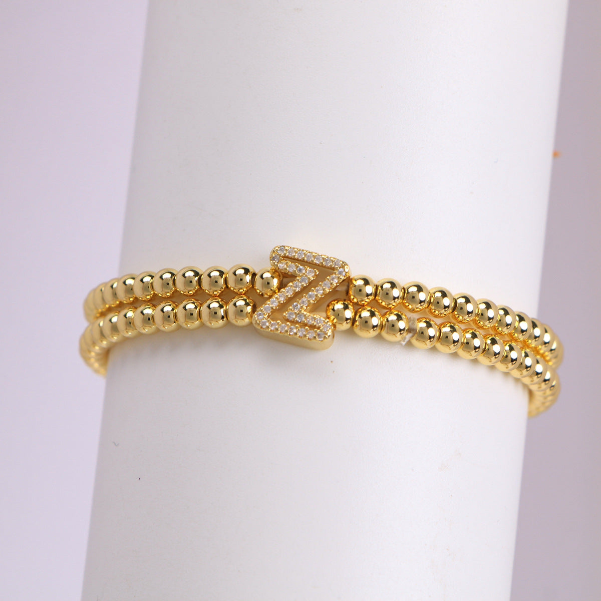 A cute and y 18k copper-plated bubble 26-letter elastic string beaded bracelet