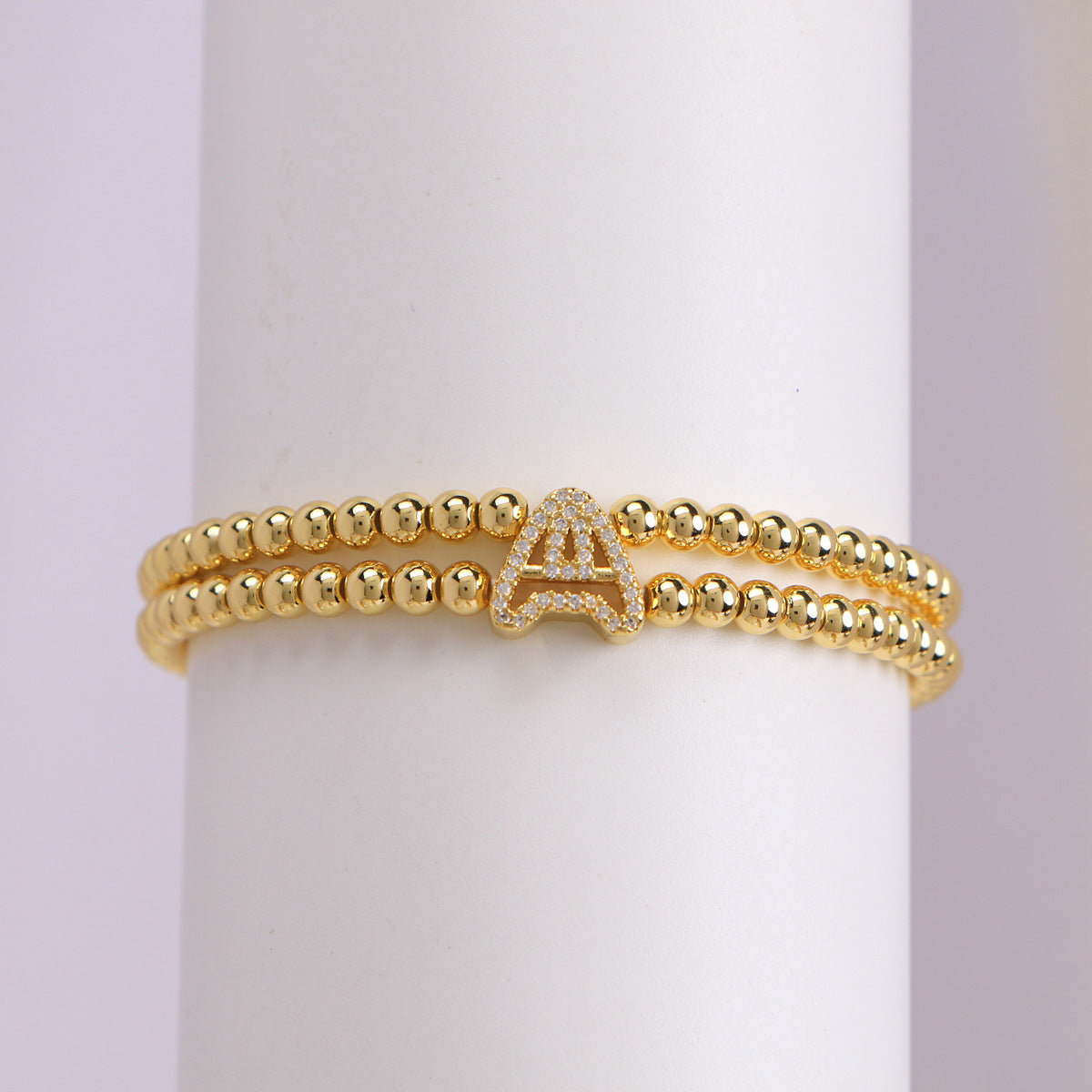 A cute and y 18k copper-plated bubble 26-letter elastic string beaded bracelet