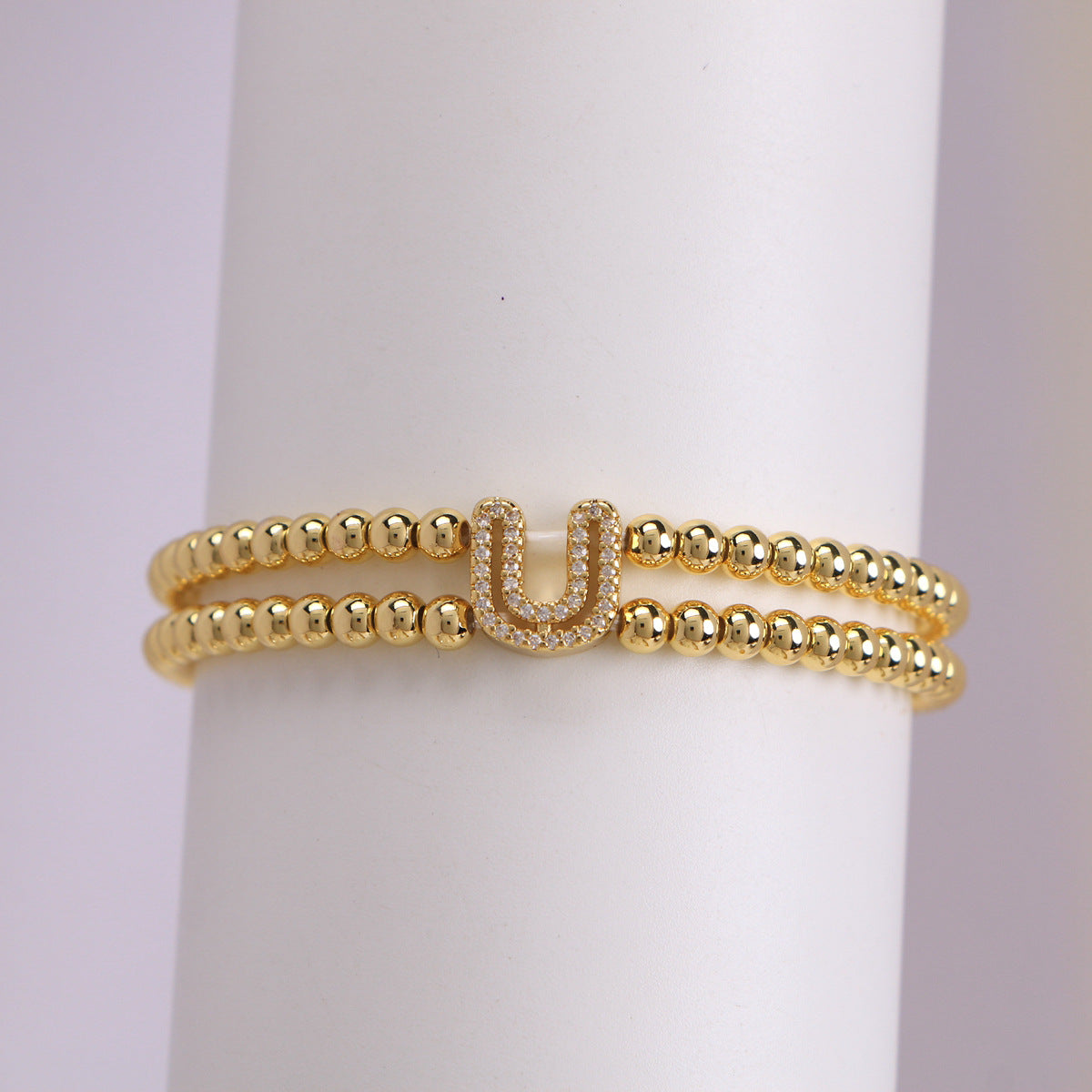 A cute and y 18k copper-plated bubble 26-letter elastic string beaded bracelet