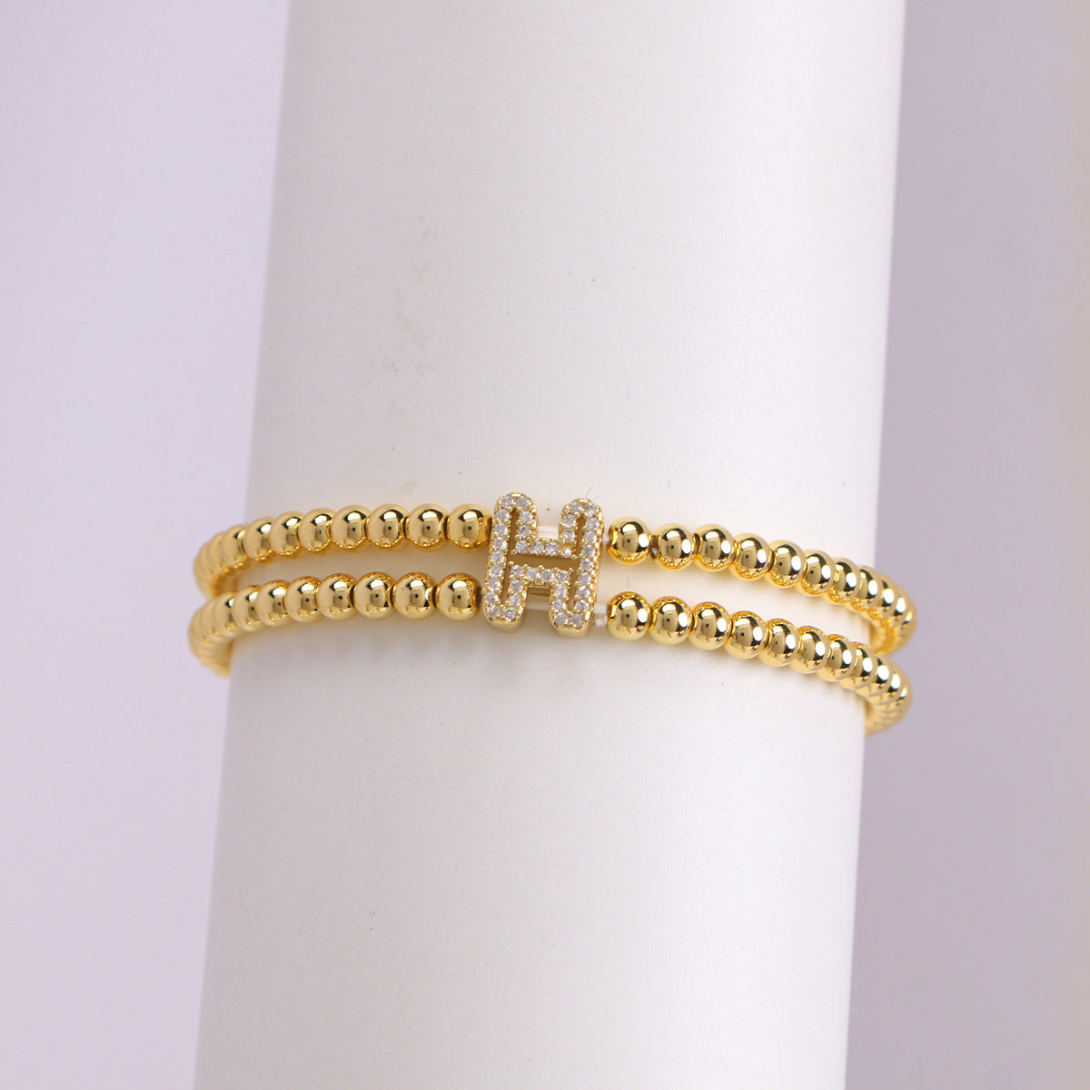 A cute and y 18k copper-plated bubble 26-letter elastic string beaded bracelet