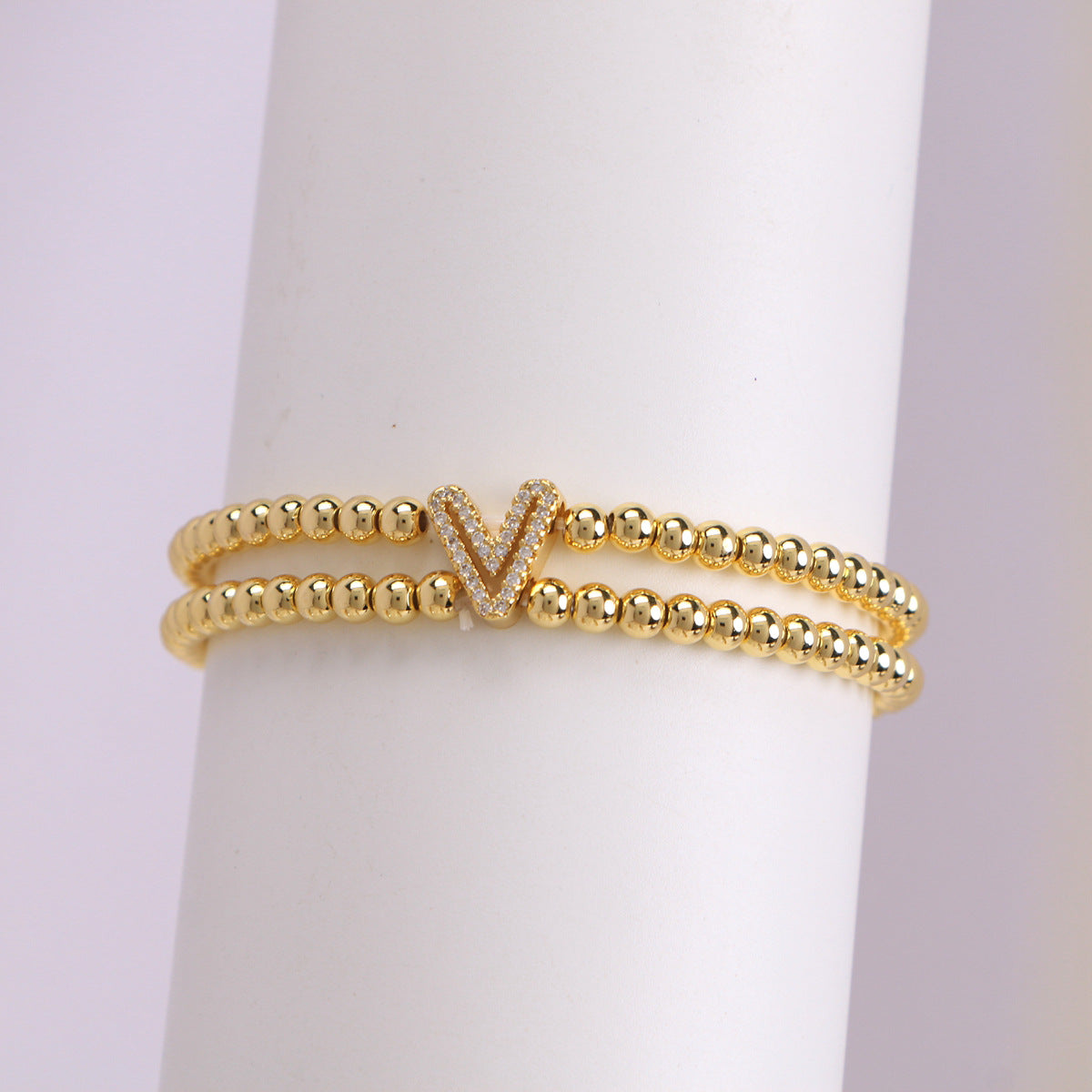 A cute and y 18k copper-plated bubble 26-letter elastic string beaded bracelet