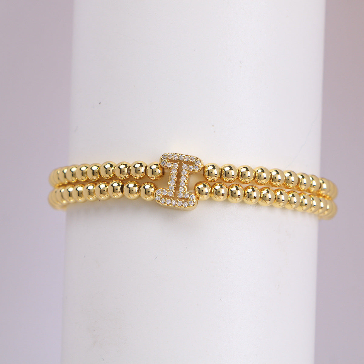 A cute and y 18k copper-plated bubble 26-letter elastic string beaded bracelet