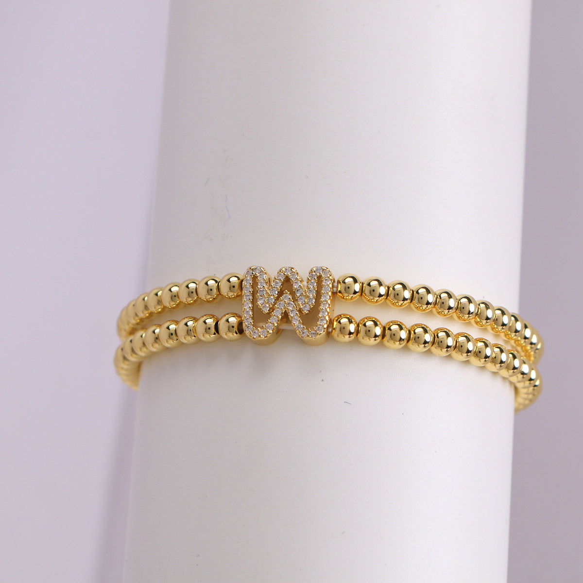 A cute and y 18k copper-plated bubble 26-letter elastic string beaded bracelet