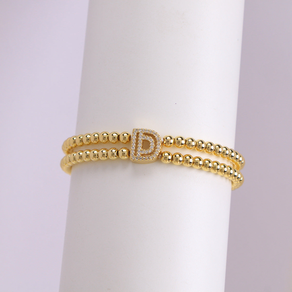 A cute and y 18k copper-plated bubble 26-letter elastic string beaded bracelet