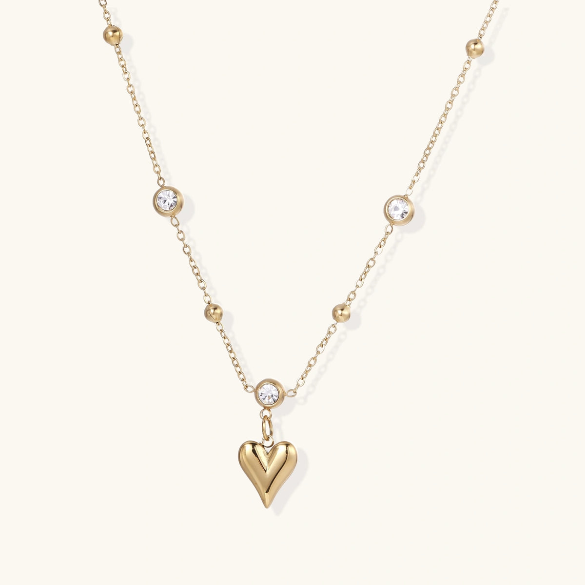 Crystal Heart Charm Necklace in gold with heart pendant and clear crystal accents