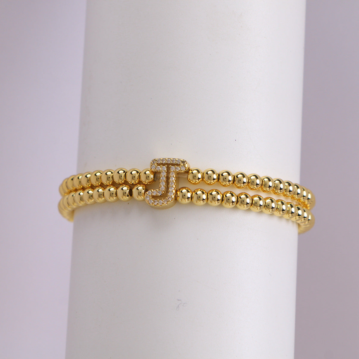 A cute and y 18k copper-plated bubble 26-letter elastic string beaded bracelet