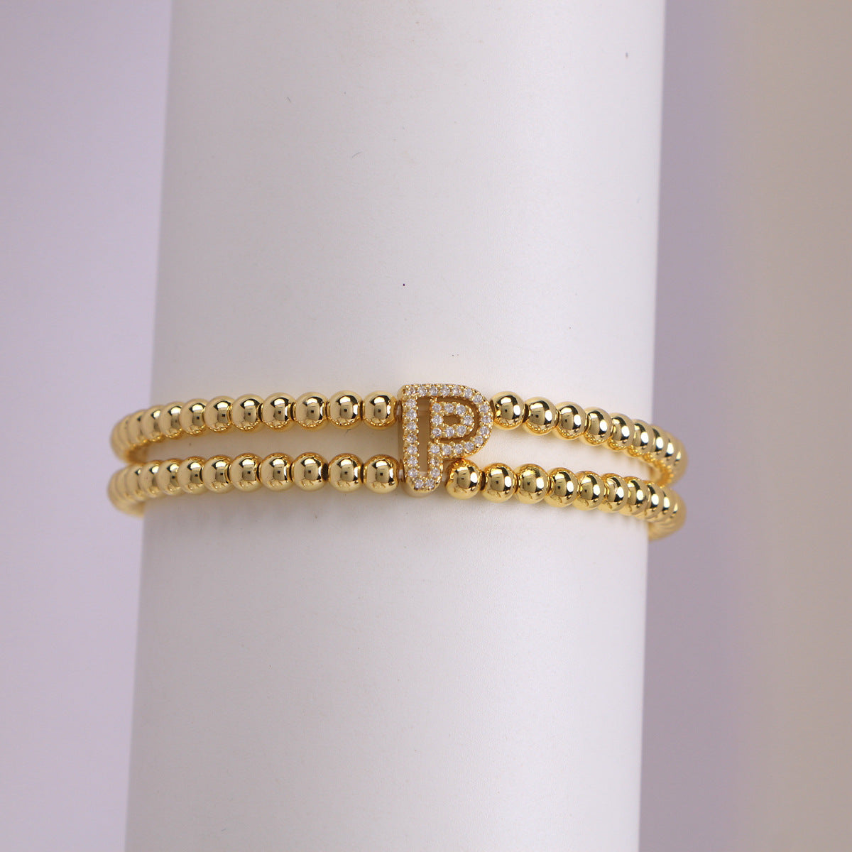 A cute and y 18k copper-plated bubble 26-letter elastic string beaded bracelet
