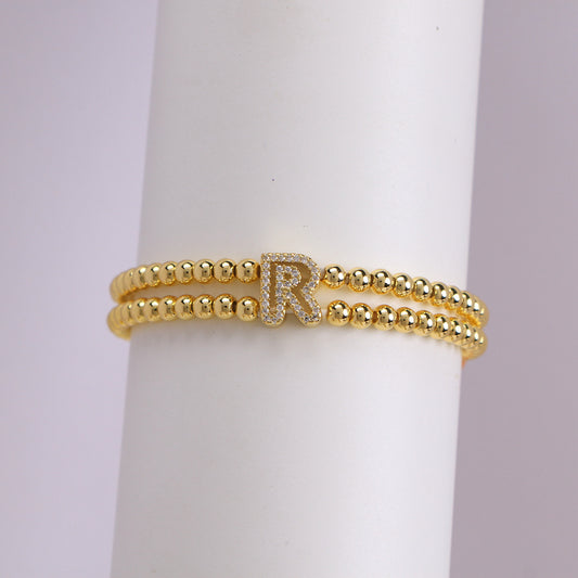 A cute and y 18k copper-plated bubble 26-letter elastic string beaded bracelet