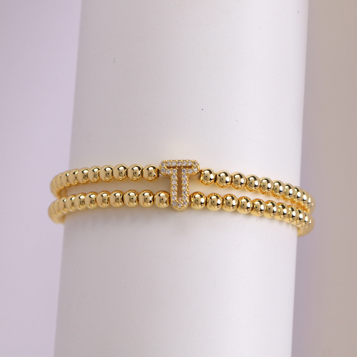 A cute and y 18k copper-plated bubble 26-letter elastic string beaded bracelet